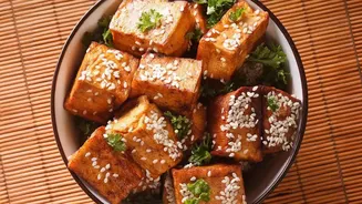 The dish is Korean-inspired rather than a claim of strict authenticity Matters Because Gochujang gives tofu rice bowls fermented heat and sweetness