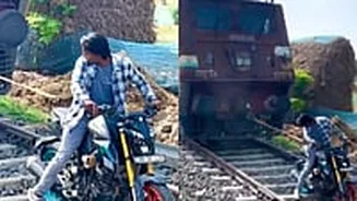 Outrage After Viral Video Shows Man Trying To Move Train With Bike In West Bengal; Netizens Demand Strict Actions Against Reckless Stuntman