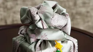 Creative ways to wrap festive gifts without plastic using fabric wraps and paper
