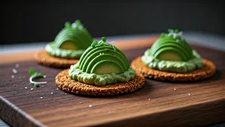 Layer Avocado Over Spiced Ragi Crackers For Midday Snacks