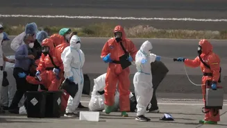 Passengers from virus-stricken cruise ship return home for monitoring