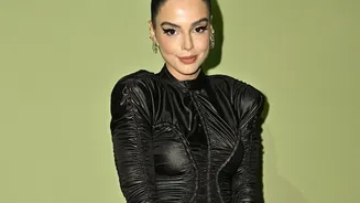 Sleek Ponytails and Top Knots Help Control Monsoon Frizz while Keeping Strands Back
