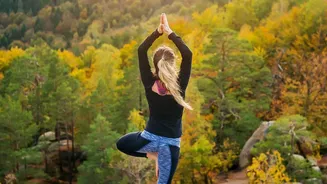 What To Know About Eagle-Inspired Leg And Arm Positions In Tree Pose Variations In Yoga