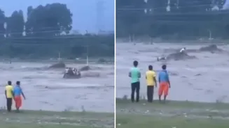 Men swept away in river after cloudburst.