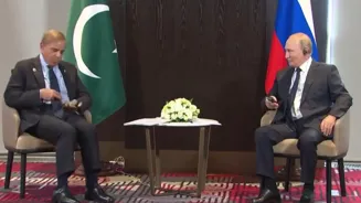 Putin Laughs As Pakistan PM's Headphone Falls