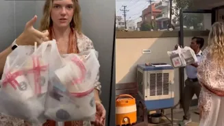 Tourist Throws Trash Over Wall in India