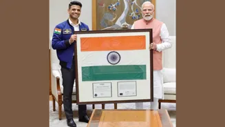 Astronaut Gifts PM Modi Space-Flown Flag
