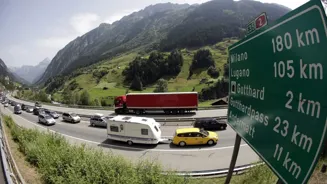 Swiss resent German tourists clogging Alps.