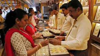 Gold dips globally, rises in India. Buy now?